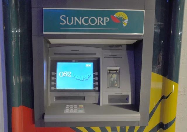 Automated teller machine located in Fairfield (Brisbane, Queensland, Australia) showing the loading screen for its operating system, OS/2 . This particular ATM was faulty and kept rebooting every time it went to dispense cash. ATM Route Cash Loading Frequency: How Often Should You Restock?